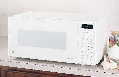 MICROWAVE OVENS This trim kit allows for built-in installation of the 1.8 countertop microwave oven in a wall or cabinet alone, or over a 30" single electric wall oven as shown.