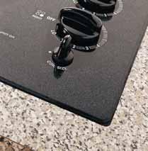 This CleanDesign cooktop has five ribbon elements of varying sizes, plus a bridge burner that connects two 7" elements to create an elongated cooking area.