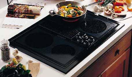 GRIDDLE ACCESSORY (For use with optional grill module) Place over heating element and reflector pan from optional grill module. Griddle accessory has a non-stick coating and is self-draining.