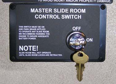 Slideout Lock switches are located near the slideout control switches on the dash or on a wall in an area near the slideout room.