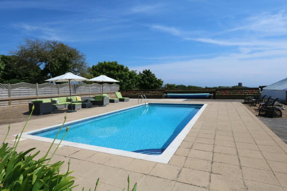 The pool is fully tiled and heated with a patio surround which creates a perfect entertaining area.