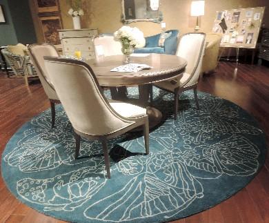 PARIS EDITION Rugs in the Paris Edition include Papillion, an outlined butterfly motif which comes in a round in teal, and rectangles in teal or gold; the Art Nouveau overall floral in two colorways,