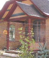 flared eaves, square posts, plain balustrade, and