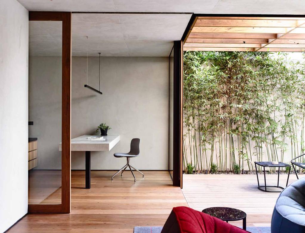 created a northern light-well courtyard for natural light, ventilation, and connection with the outdoors A view of the basement powder room with the laundry beyond The floor is tallowwood eucalyptus,