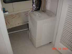 Stand-alone dehumidifier installed in mechanical
