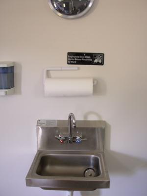 Examples of hand washing facilities are: A self-contained portable unit with holding tanks for potable tempered water (warm water) and waste water.