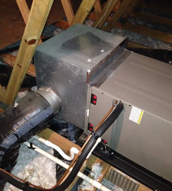 Ductwork was not visible within the attic due to blown insulation but it is assumed that these fans discharge into the attic space. b. There is a small blower coil unit installed within the attic which acts as exhaust for a room in the Police area.