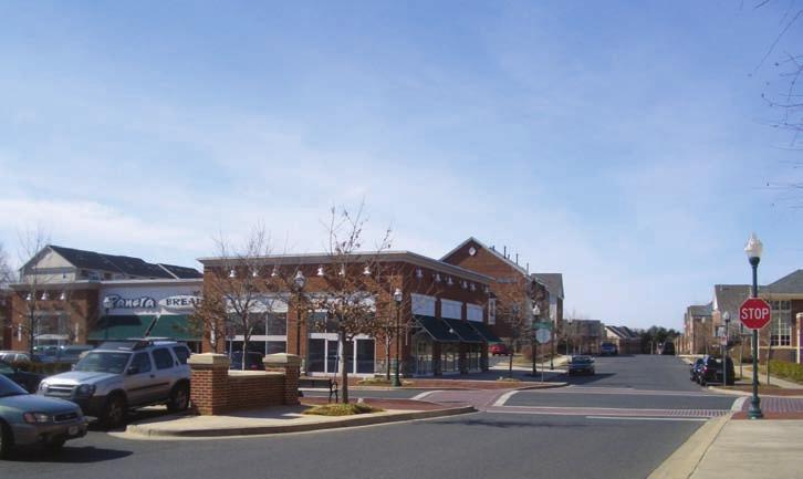 This mixed-use village center is within walking distance of the adjacent residential neighborhood. Sidewalks and pedestrian crosswalks connect the various land uses.