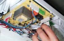 5.6. To replace printed circuit board (PCB)? Gain access to rear of control panel.? Unscrew and remove external controls/mains connection access cover.