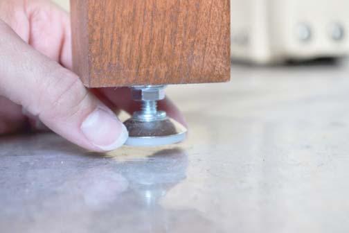 leg(s). Twist the knob on the bottom of table leg up or down until you achieve an even height.