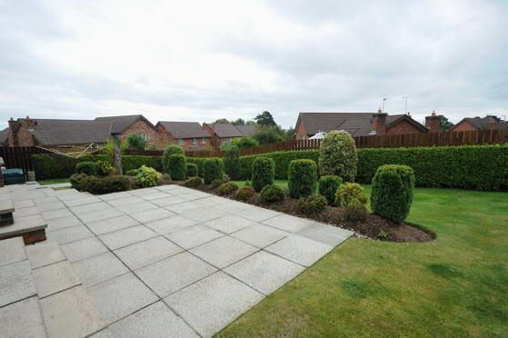 lawns with shrubberies, flowerbeds and