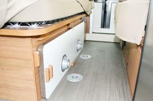 Remove dining table from storage location (attached by latch on passenger side twin bed cabinet.