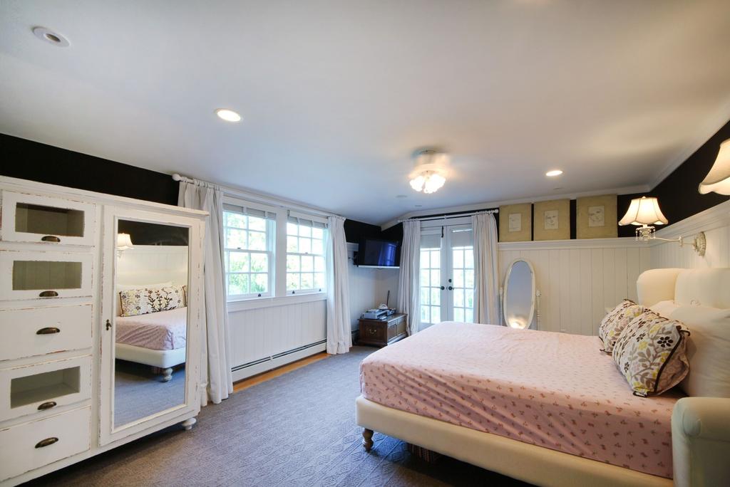 The other spacious bedrooms on this level are fully carpeted and all have lots of light.