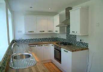 The breakfast kitchen has been replaced with an attractive range of units which include oven, hob and cooker hood.