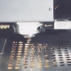 Laser sealed pharmaceutical ampoules Initially flat sheet material was moved under a fixed laser beam, as with steel in combination with a punch press.