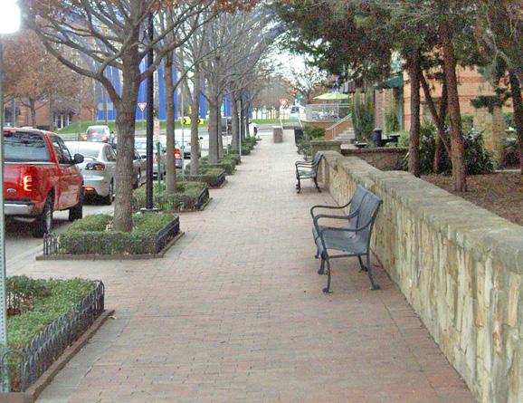 Figure 2-6a Incorporate plantings that define the edges of sidewalks, pedestrian paths and outdoor amenity spaces.