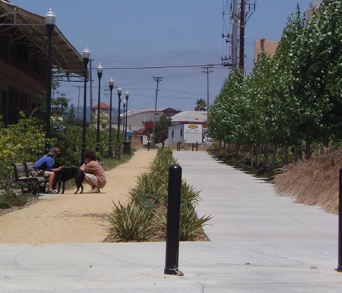 2.7 Develop a coordinated experience along all streetscapes to establish a sense of visual continuity. a. Use a consistent palette of landscape materials including: Plant materials Paving materials Site furnishings b.