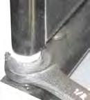 To increase tension, turn wrench toward the door handle until torsion rod seats in bottom hinge plate assembly. An audible click is heard while adjusting.