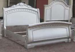 bed has ornamental crown moldings and natural marble caps Velvet upholstered bed is tufted with faux crystals Matching bench, vanity, vanity mirror, and chair are