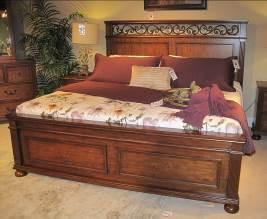 B529 Lazzene (Signature Design) Traditional bedroom made with pine solids and birch veneers in a rich light brown cherry color finish Features fluted pilasters and