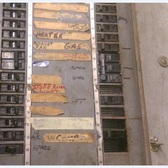 The main distribution panel contains a 200A main circuit breaker and an additional thirty-six (36) breakers for equipment, lighting, and power.