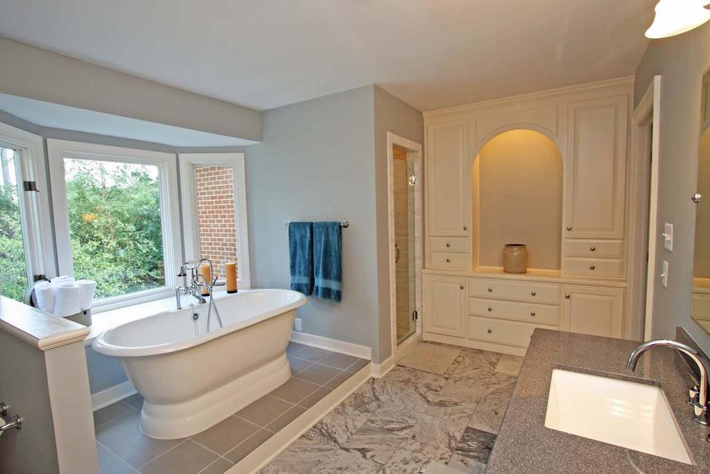 sitting area 9 5 x 6 ; private bathroom Master Bath Marble tile floor; double granite vanity with storage below; separate
