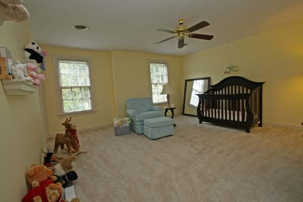 Bedroom #2 16 5 x 16 3 (front left yellow) Carpet; ceiling fan; two windows; walk-in closet; private bathroom Bathroom