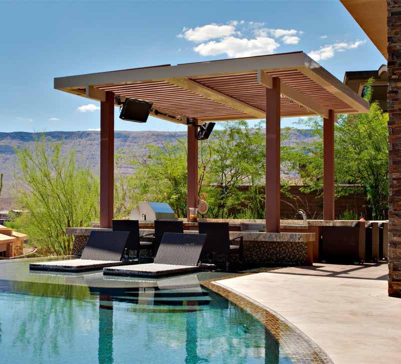 Relaxing oasis Equinox Louvered Roof systems keep you protected from the hot sun or rain.