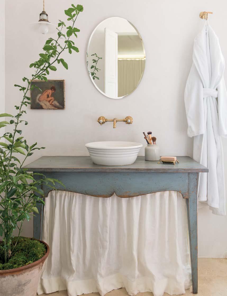 An antique Swedish side table works as Leila s sink base.
