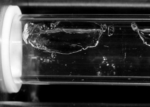 R100, Page 5 Orifice Vapor slugs Flow direction Liquid Figure 8:Inlet Flow Pattern without Porous Metal Orifice Bubbles Vapor slug