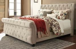 tufted upholstered bed has a linen color textured fabric Dresser has wood diamond-shaped lattice and open metal mesh accents Dovetailed drawers are fully finished and use ball-bearing