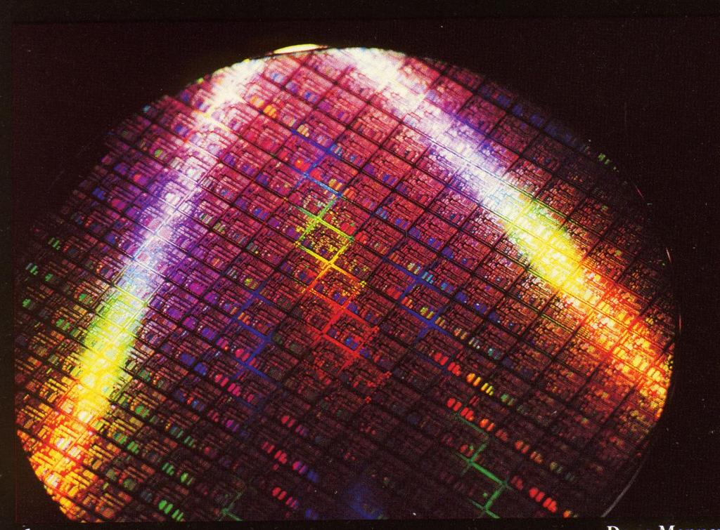 A Silicon Wafer This 8-inch wafer contains about 200 Pentium II chips (1997).