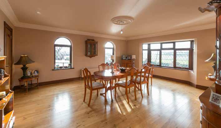 matching hearth, decorative fire inset, decorative ceiling cornice and ceiling roses, solid wooden floor, 3 single panelled radiators,