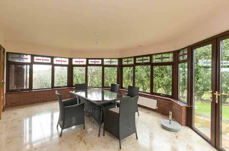 11m) Spacious sun room with beautiful polished marble tiled floor, PVC double glazed double doors to rear, connecting double doors with