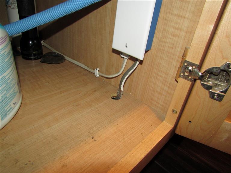 (3) The surface mounted non-metallic cable under the kitchen sink should be protected in a metal raceway or