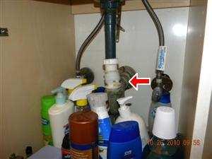 The sink drain is in need of repair prior to the reoccurrence of further damage