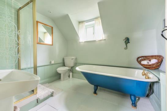 There are two large family bathrooms also located at either end of the property one with a freestanding rolltop bath, shower, WC and hand-wash basin.
