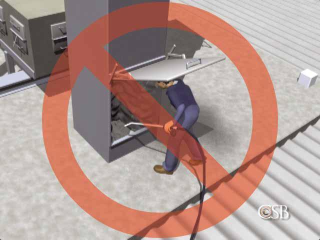 In this image from an animation, a worker uses compressed air to dislodge a dust buildup in ductwork.