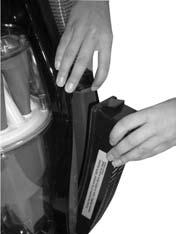 To remove the HEPA media filter cartridge, push down on the filter door latch and pull door away from the cleaner. 2.