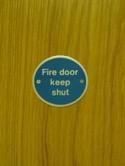If a Fire Door is wedged open or is disabled resulting in it not closing on its own, in the event of a fire in the room behind, fire and smoke will