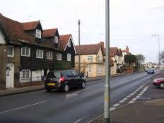 Main Road is dominated by the utilitarian lamp post and telephone posts and wires, which detract from the setting of the buildings (figure 43).