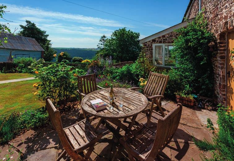 DRYHILL FARM STOODLEIGH TIVERTON DEVON EX16 9PT A beautifully restored period farmhouse, set in a spectacular elevated position enjoying far-reaching views over the Exe Valley and surrounding