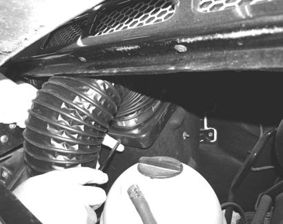 SECTION 3 DRIVING YOUR MOTOR HOME 2. Remove two screws on the front of the air filter housing.