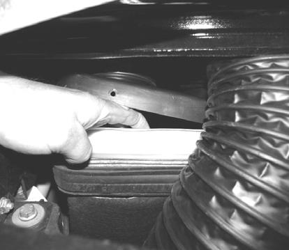 NOTE: To make removing the air filter easier, you may temporarily move the air intake hose by removing the fastener as shown in the following photo.
