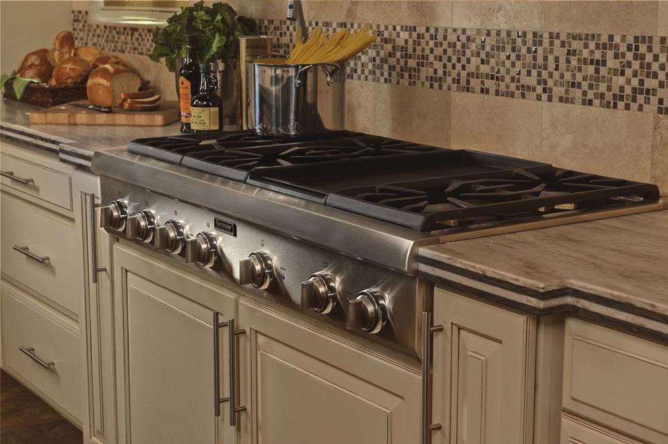 The kitchen transforms and inspires today s cooks with top-of-the-line Thermador cooking appliances. The 6-burner Professional Series Rangetop with a griddle is right at home in this luxury kitchen.