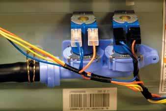 To remove the water valve: Disconnect the 2 blue wires and the orange wire from the cold water (C) solenoid. Disconnect the 2 blue wires and the brown wire from the hot water (H) solenoid.