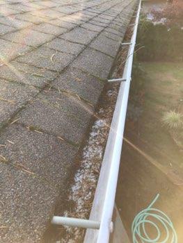Gutters Soil touching siding east side Gutters and downspouts appeared in good condition overall.