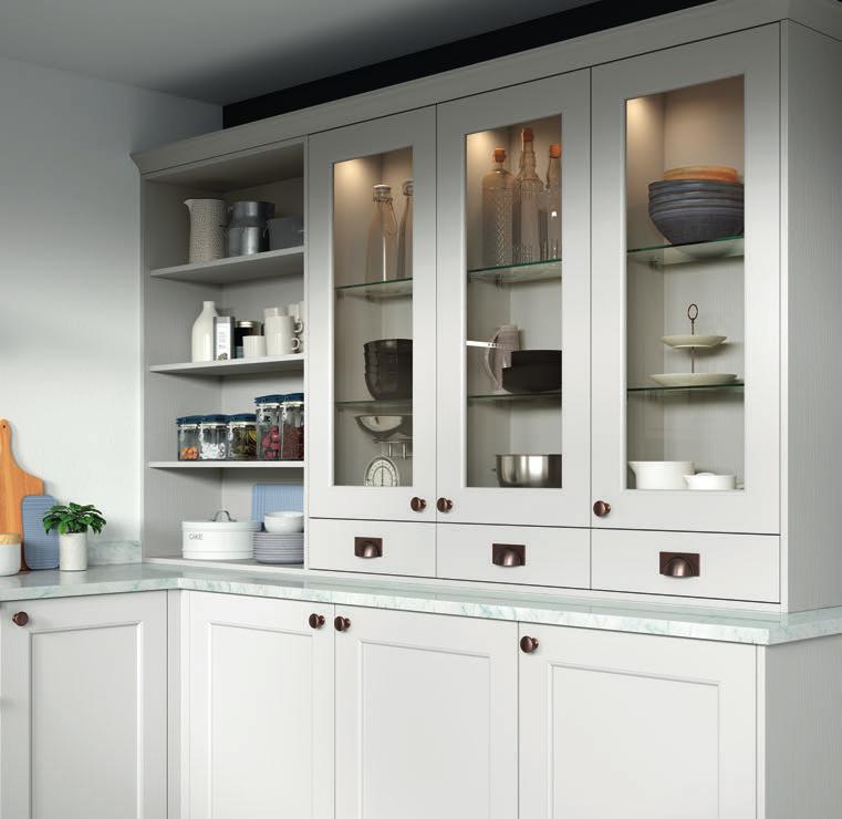 Seamlessly combine knobs and cup handles on doors and drawers.