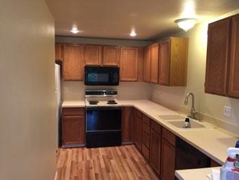 1. Kitchen Room Kitchen Walls and ceilings appear in good condition overall. Flooring is wood. Accessible outlets operate. Light fixture operates. Sink and faucets are in operable condition overall.