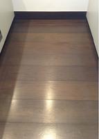 Cleaned to Professional clean standards. Item Floors Description Dark wood floor boards.
